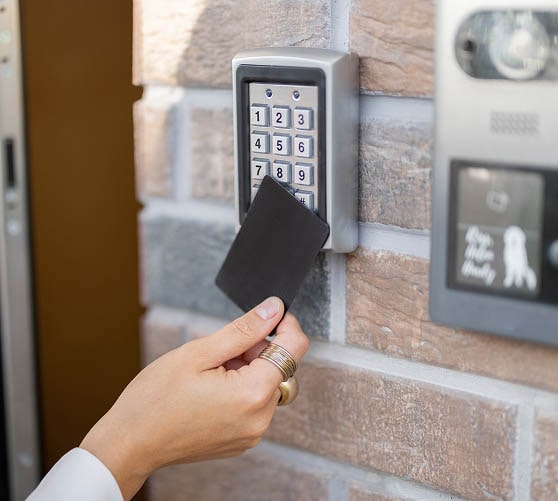 Person using a keypad entry card