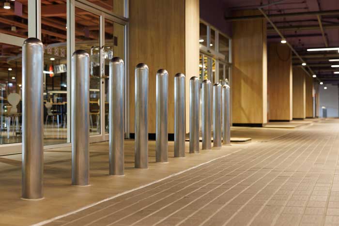 steel bollards in front underground entrance of the building.