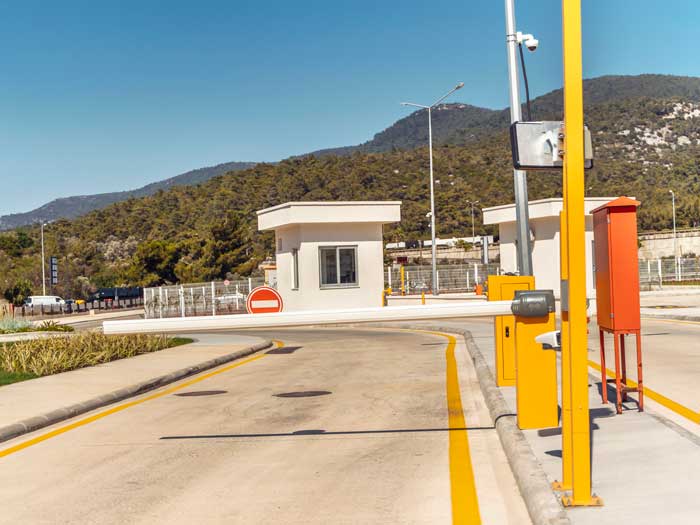 automatic Barrier on the road , a security guard's booth. Security system.